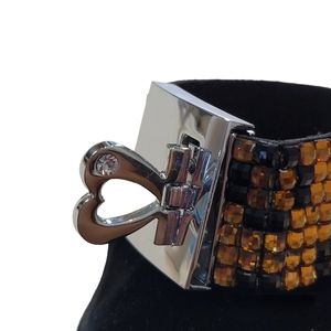 Leopard print silver bracelet.